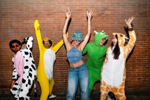 Multiethnic group of young friends having fun on the stretts in